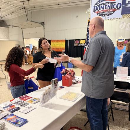 Craig Sullivan handing literature to fairgoers