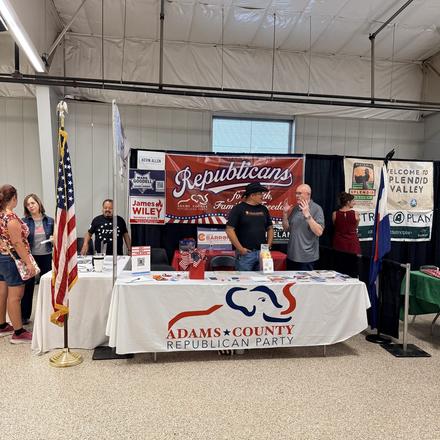 The county party booth on the first evening of the fair