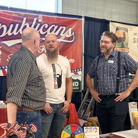 Craig Sullivan talking with other candidates at the booth