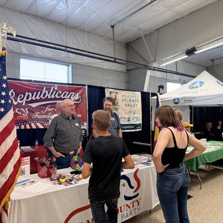 Fairgoers at the county party booth
