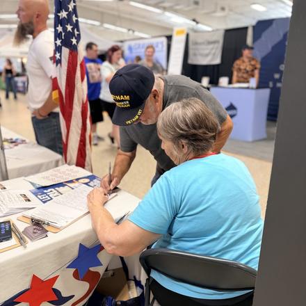 Signing in at the county party booth