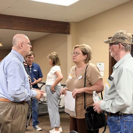 Craig Sullivan talking with members before the meeting