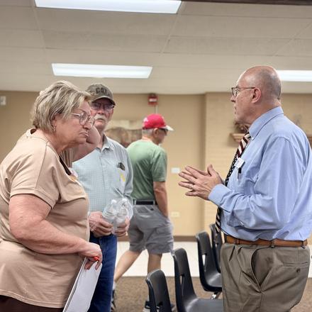 Craig Sullivan in conversation with members before the meeting