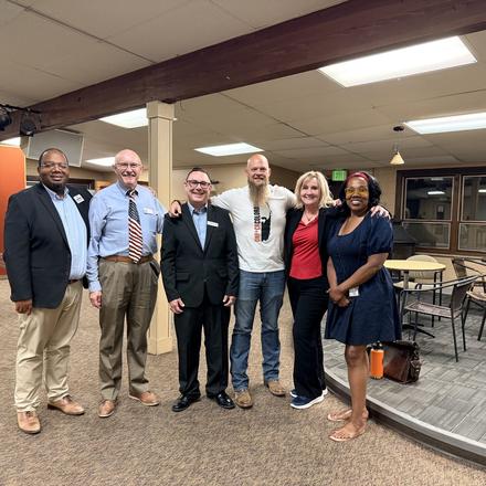 Craig Sullivan standing with fellow candidates at the close of the meeting