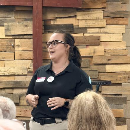 A speaker addressing the county party meeting