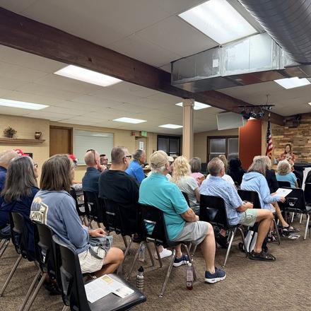 Members seated for the August county party meeting
