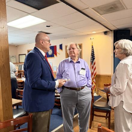 Craig Sullivan talking with a guest before the Lincoln Club lunch