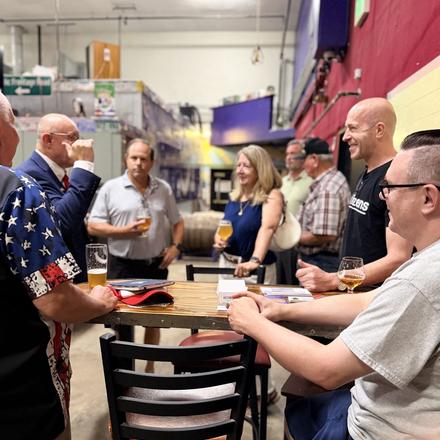 Guests gathered at the table during the meet and greet