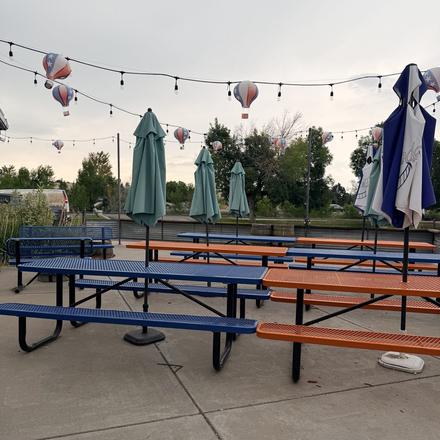 The patio outside, with hot air balloons in the sky beyond