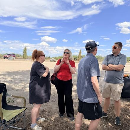 Guests talking in the shade at the Young Republicans cookout
