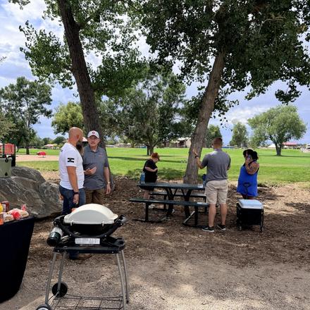 The grill going under the cottonwoods before the cookout